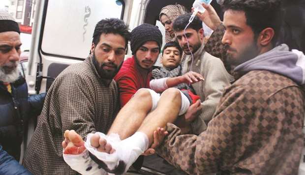 An injured student is taken to a hospital in Srinagar yesterday following a blast at a school in Kakapora area of Pulwama district.