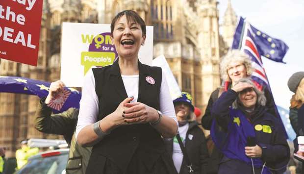 Green Party MP Caroline Lucas speaks to anti-Brexit pro-EU demonstrators outside the Houses of Parliament in London yesterday.