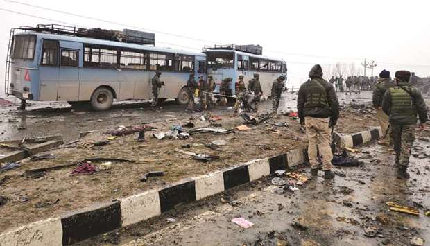 Soldiers examine the debris after the explosion in Lethpora in south Kashmiru2019s Pulwama district.