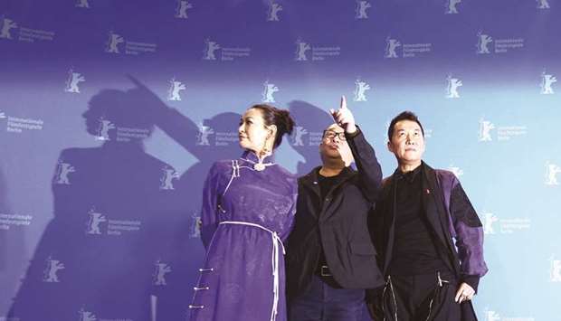 Director, screenwriter and producer Wang Xiaoshuai, with actors Ai Liya and Zhao Yanguozhang, during a photocall to promote the movie Di jiu tian chang (So Long, My Son) at the 69th Berlinale.
