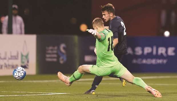 Carles Moscardo (right) of Real Madrid scores past Spartak Moscow's goalkeeper Pavel Boriskin during the under-17 Al Kass International Cup at the Aspire Academy yesterday.