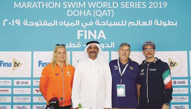 QSA President Khaleel al-Jabir (second left), FINA Technical Delegate John West (second right), the Netherlandsu2019 swimmer Sharon Van Rouwendaal (left) and Simone Ruffini of Italy pose after a press conference yesterday.
