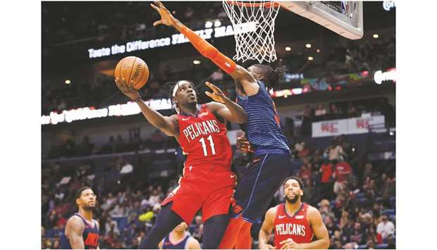 New Orleans Pelicans guard Jrue Holiday (left) shoots as Oklahoma City Thunder forward Nerlens Noel (right) defends during the second-half of their NBA game at the Smoothie King Center. PICTURE: USA TODAY Sports
