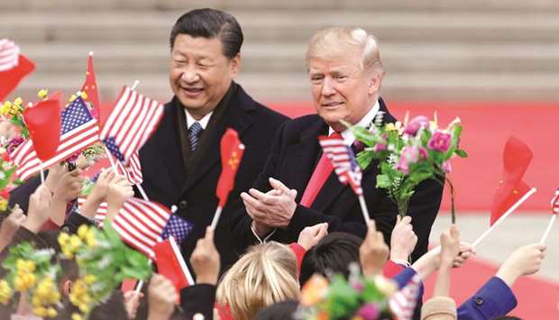US President Donald Trump (right) and Xi Jinping, Chinau2019s president, greet attendees during a welcome ceremony outside the Great Hall of the People in Beijing (file). u201cItu2019s going extremely well,u201d Trump said, referring to two days of high-level trade negotiations that wrapped up yesterday in Beijing. President Xi said the meetings u201cachieved important progress in another step,u201d according to Chinau2019s Xinhua News Agency.