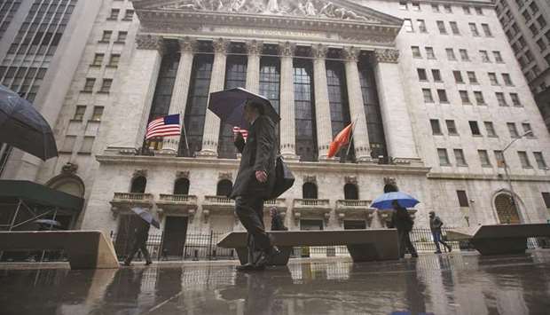 Pedestrians walking past the New York Stock Exchange. As the United Kingdomu2019s Brexit crisis deepens, Goldman Sachs and JPMorgan have differing views of the ultimate outcome but the two titans of Wall Street agree on one thing: They donu2019t believe there will be a no-deal Brexit.