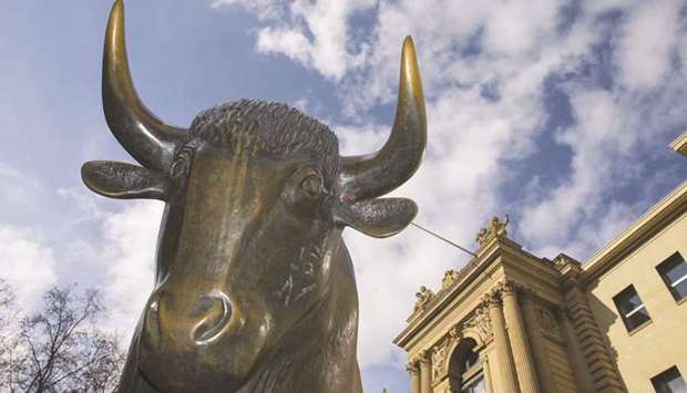 A statue of a bull is seen outside the Frankfurt Stock Exchange. The DAX 30 closed 1.9% up at 11,299.80 points yesterday.