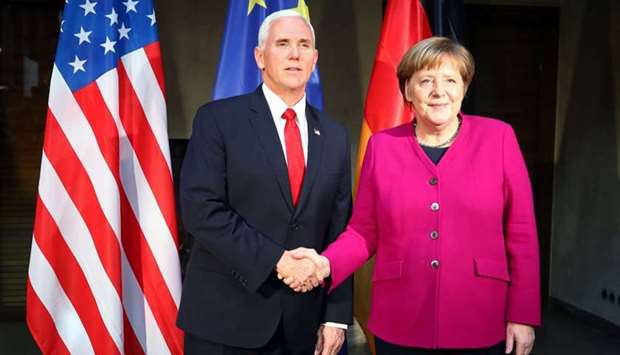 US Vice President Mike Pence shakes hands with German Chancellor Angela Merkel during the annual Munich Security Conference in Munich, Germany