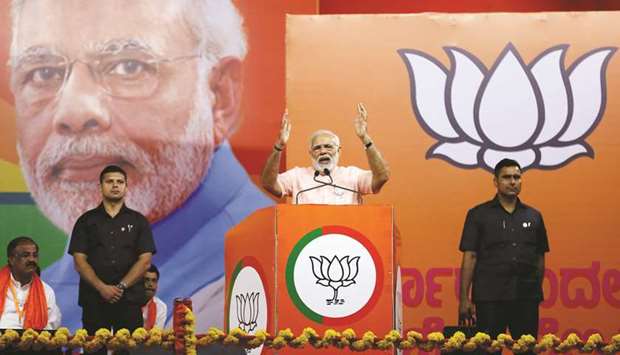 Prime Minister Narendra Modi addresses an election campaign rally ahead of the Karnataka state assembly elections in Bengaluru, on May 8, 2018. Modiu2019s ruling Bharatiya Janata Party won a surprise majority in 2014. Until last year, many predicted a similar result.