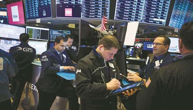 Traders work on the floor of the New York Stock Exchange (file). For the first quarter, analysts are forecasting a year-over-year S&P 500 earnings decline of 0.5%, according to IBES data from Refinitiv.