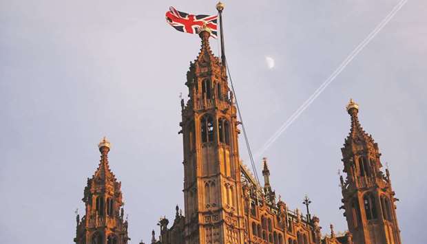 The moon is pictured rising beyond a Union flag flying from atop the Victoria Tower at the Houses of Parliament in London on Wednesday. The EU and the UK arenu2019t really co-operating on no-deal planning except in one major area u2013 finance u2013 where both sides would stand to lose from a big market meltdown. Cooperation deals will enable UK and EU regulators to supervise each othersu2019 markets, and thereu2019s a plan in place to avoid a cross-channel rupture in the multitrillion-dollar derivatives industry by ensuring EU banks can continue settling trades at clearinghouses in London.