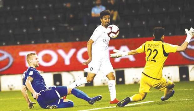 Al Saddu2019s Akram Afif (centre) scores against Al Khor during the QNB Stars League match at the Al Sadd stadium yesterday. PICTURE: Shemeer Rasheed