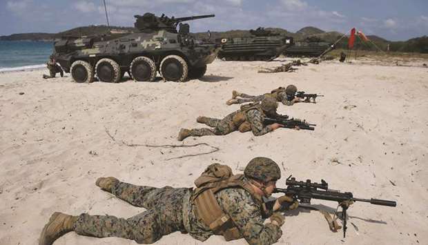 US Marines occupy the beach during an amphibious landing in Chonburi yesterday at the multi-nation Cobra Gold military exercises.