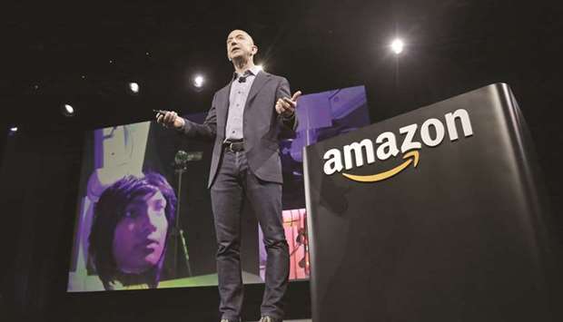 Amazon CEO Jeff Bezos discusses his companyu2019s new smartphone at a news conference in Seattle (file). Since Bezos announced his divorce in early January, the companyu2019s shares have declined 2.9%, missing Wall Streetu2019s early 2019 rally.