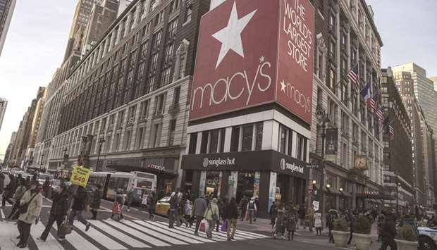 Pedestrians walk in front of a Macyu2019s department store in New York. Consumer sentiment took a beating in recent months amid the longest-ever US government shutdown, but measures have shown improvement after Washington averted another closure while keeping trade talks with China moving toward an eventual resolution.