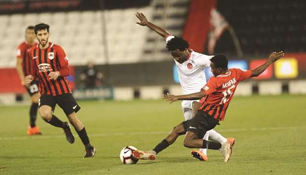 Al Rayyan (red and black) players in action during their QNB Stars League match against Al Arabi on Thursday.