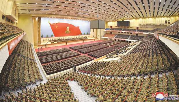Delegates take part in a national meeting to celebrate the 77th birth anniversary of former North Korean leader Kim Jong-il at Pyongyang Indoor Stadium in Pyongyang yesterday.