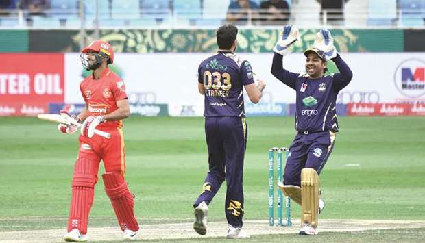 Quetta captain and wicket-keeper Sarfraz Ahmed  (R) and bowler Tanvir  Sohail celebrate  the fall of an Islamabad wicket yesterday.