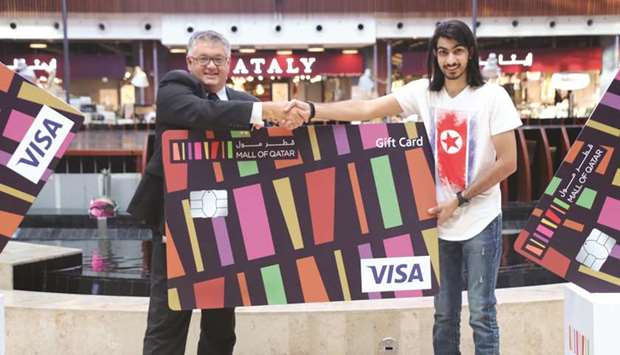 A winner of Mall of Qatar Shop & Win Promotion in June 2018 with CEO Stuart Elder.
