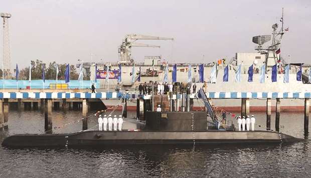A handout picture provided by the Iranian presidency yesterday, shows Iranian President Hassan Rouhani during the unveiling of Iranu2019s first semi-heavy submarine named the Fateh (Farsi for u2018Conqueroru2019) at the Bandar Abbas naval base.