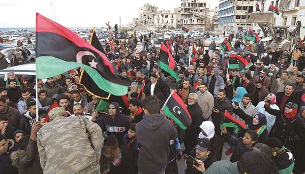 People gather to mark the eighth anniversary of the uprising in Libyau2019s second city of Benghazi, yesterday.