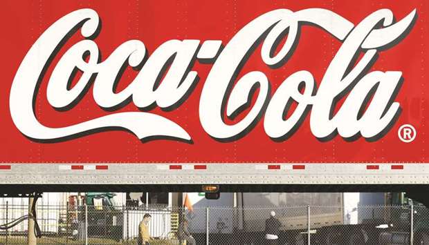 A man walks past a Coca-Cola truck at a distribution centre in Alexandria (file). Coca-Cola is  turning to Europeu2019s deal-hungry bond market as the US soda maker bets on coffee to help counter waning demand for fizzy drinks.