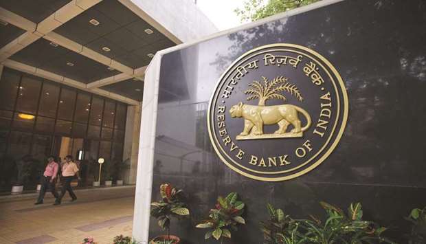 Reserve Bank of India signage is displayed at the entrance to the banku2019s headquarters in Mumbai. The RBI approved Rs280bn ($4bn) as interim dividend to the Indian government, according to a statement.