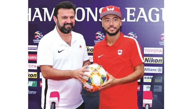 Al Rayyan coach Bulent Uygun (left) and captain Rodrigo Tabata pose after a press  conference yesterday, ahead of their match against Iranu2019s Saipa.