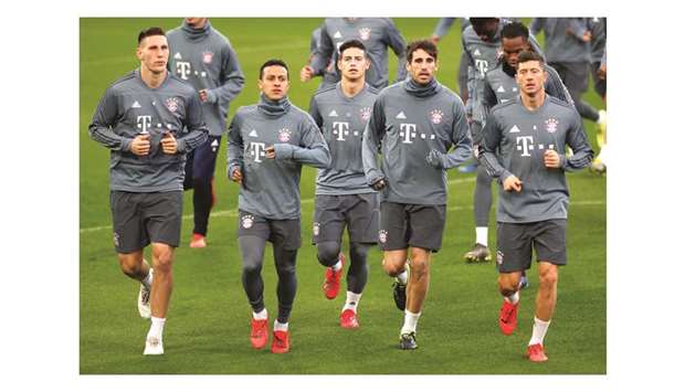 Bayern Munichu2019s Niklas Sule (from left), Thiago Alcantara, James Rodriguez, Javi Martinez and Robert Lewandowski with teammates during training at Anfield, Liverpool yesterday.  (Reuters)