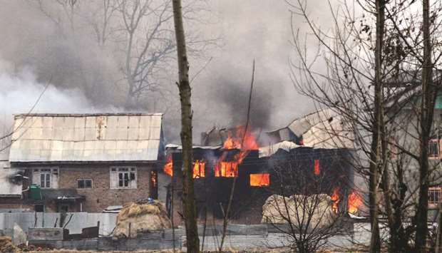 A house in which militants are suspected to have sheltered is in flames after a gunfight broke out between rebels and security forces in Pinglan village in Pulwama district yesterday.