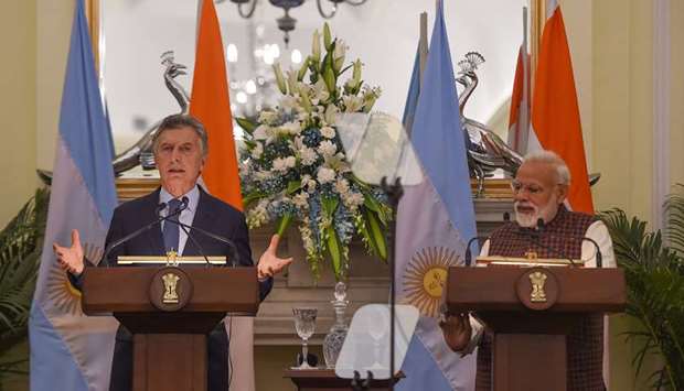 Indian Prime Minister Narendra Modi looks on as Argentinau2019s President Mauricio Macri speaks during a joint press briefing at the Hyderabad House in New Delhi yesterday.