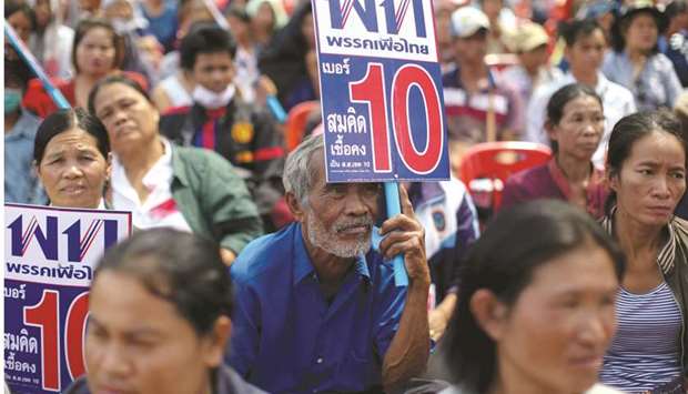 Supporters of Pheu Thai Party attend an election campaign in Ubon Ratchathani Province.