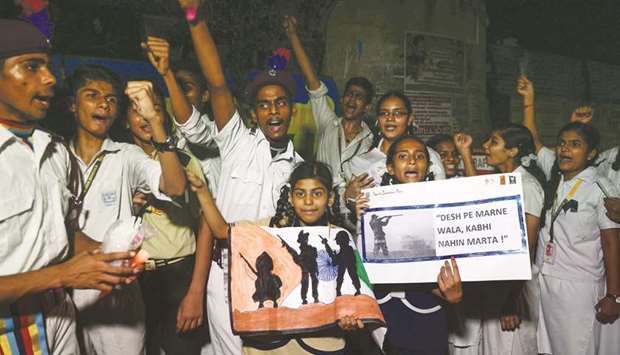 Students hold placards and shout slogans during a procession to pay tribute to the Central Reserve Police Force (CRPF) personnel killed in a terror attack in Kashmir, in Chennai yesterday.