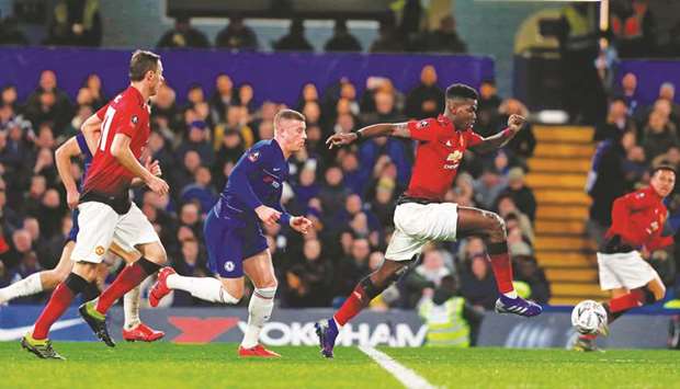 Manchester Unitedu2019s Paul Pogba (centre) runs with the ball during the FA Cup fifth round match against Chelsea at Stamford Bridge in London on Monday night.(AFP)