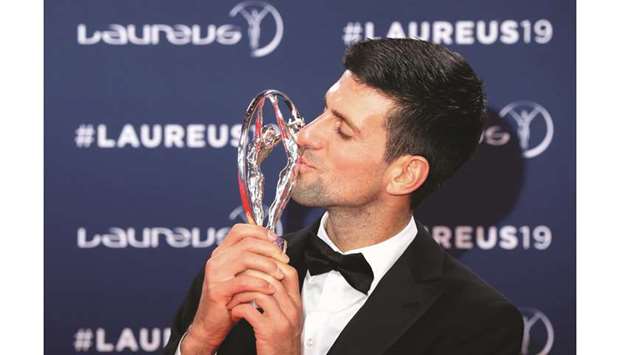 Sportsman of The Year 2019 winner, Serbian tennis player Novak Djokovic, poses with his award at the 2019 Laureus World Sports Awards ceremony in Monaco on Monday. (AFP)