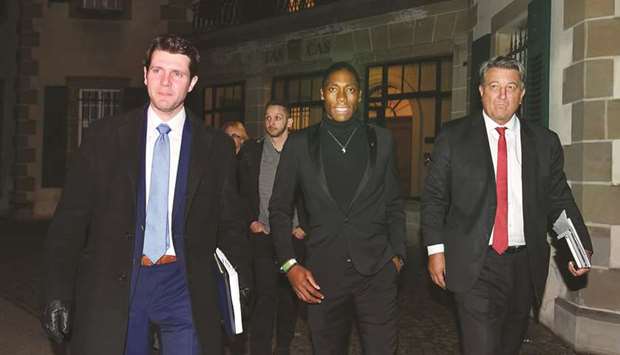 South Africau2019s Olympic champion Caster Semenya (centre) and her lawyer Gregory Nott (right) leave after a landmark hearing at the Court of Arbitration (CAS) in Lausanne. (AFP)