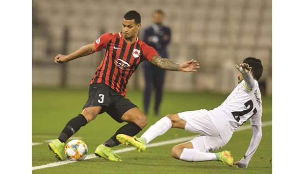 Al Rayyanu2019s Gelmin Rivas (left) in action against Saipa during their AFC Champions League group stage match at Jassim bin Hamad Stadium in Doha yesterday. PICTURES: Noushad Thekkayil