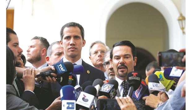 French ambassador to Venezuela Romain Nadal speaks at a news conference next to Venezuelan opposition leader Juan Guaido in Caracas, Venezuela, yesterday.