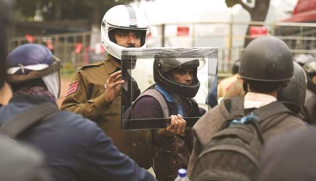 Traffic Police constable Sandeep Shahi holds up a mirror as part of a safety awareness campaign in New Delhi.