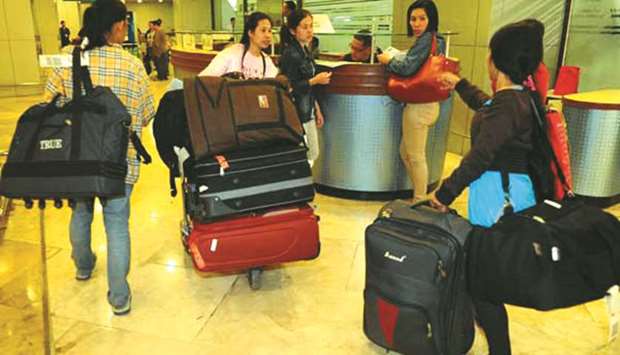 File photo shows Overseas Filipino Workers from the Middle East at the Ninoy Aquino International Airport.