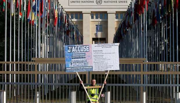 A man wearing a yellow vest demonstrates outside the United Nations ahead of the Human Rights Council in Geneva, Switzerland