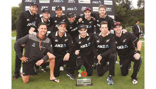 New Zealand players pose as they celebrate their series win following the third one-day international against Bangladesh at University Oval in Dunedin yesterday. (AFP)