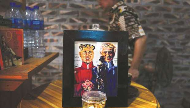 The portraits of US President Donald Trump and North Korean leader Kim Jong-un by Vietnamese artist Tran Lam Binh are displayed at a cafe in Hanoi ahead of the second Trump and Kim summit.