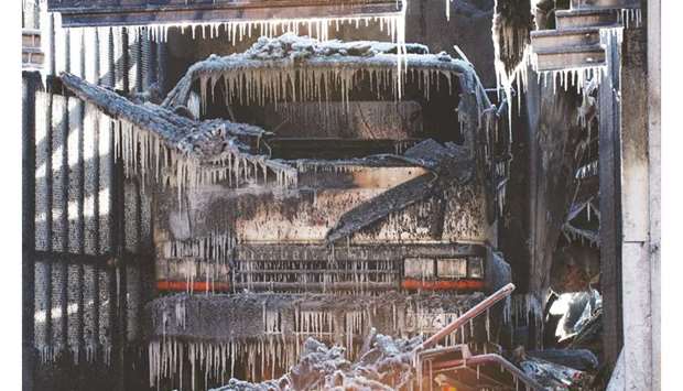 Icicles are seen on a truck after a large fire was extinguished by the New York Fire Department (NYFD), in the Brooklyn Borough of New York.