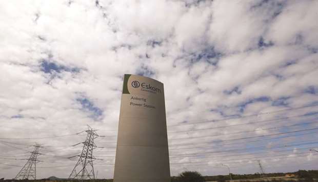 Pylons carry electricity from a sub-station of state power utility Eskom outside Cape Town (file). South Africau2019s National Treasury now considers Eskom the biggest threat to the nationu2019s finances.