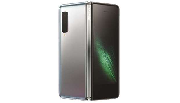 Samsungu2019s new Galaxy Fold smartphone which features the worldu2019s first 7.3-inch Infinity Flex Display that works with the next-generation 5G networks is seen in San Francisco. The worldu2019s largest smartphone makeru2019s stock was little changed yesterday amid mixed comments from analysts and Twitter observers regarding the Galaxy Foldu2019s high price tag, functionality and sales prospects.