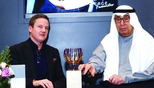 Alfardan Group chairman Hussain Ibrahim Alfardan unveils the u2018Spirit of Ecstasyu2019 egg together with Faberge managing director Antony Linday at the Faberge booth on Thursday. PICTURE Jayan Orma