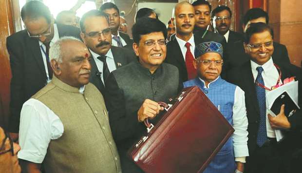 Interim Finance Minister Piyush Goyal holds his briefcase as he arrives at the parliament to present 2019-20 budget in New Delhi yesterday.