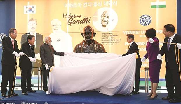 Prime Minister Narendra Modi (third left) unveils a bust of Mahatma Gandhi with South Koreau2019s President Moon Jae-in (third right) and former secretary-general of the United Nations Ban Ki-moon (left) at Yonsei University in South Koreau2019s capital Seoul. Modi is on a two-day official visit to South Korea.