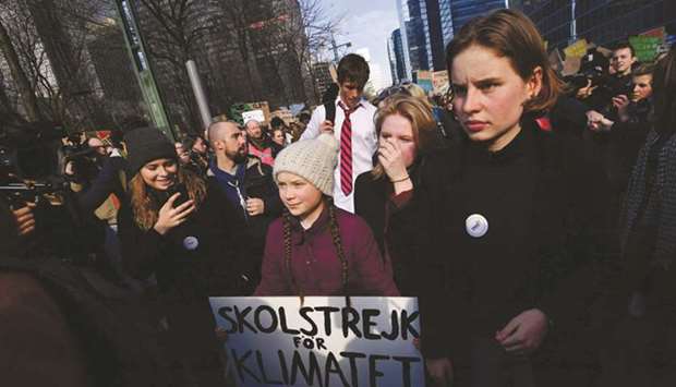 Thunberg (centre) takes part in a march in Brussels for the environment and the climate organised by students.