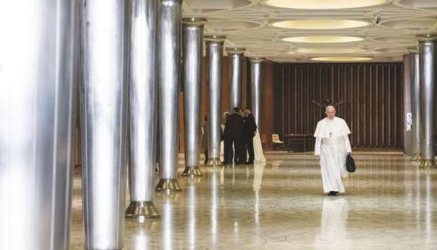 This handout photo shows Pope Francis heading for global child protection summit for reflections on the sex abuse crisis within the Catholic Church, at the Vatican.